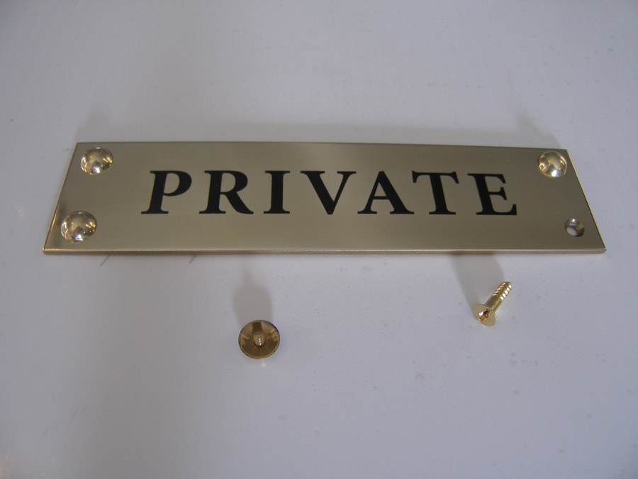 Brass plaque with dome fixings