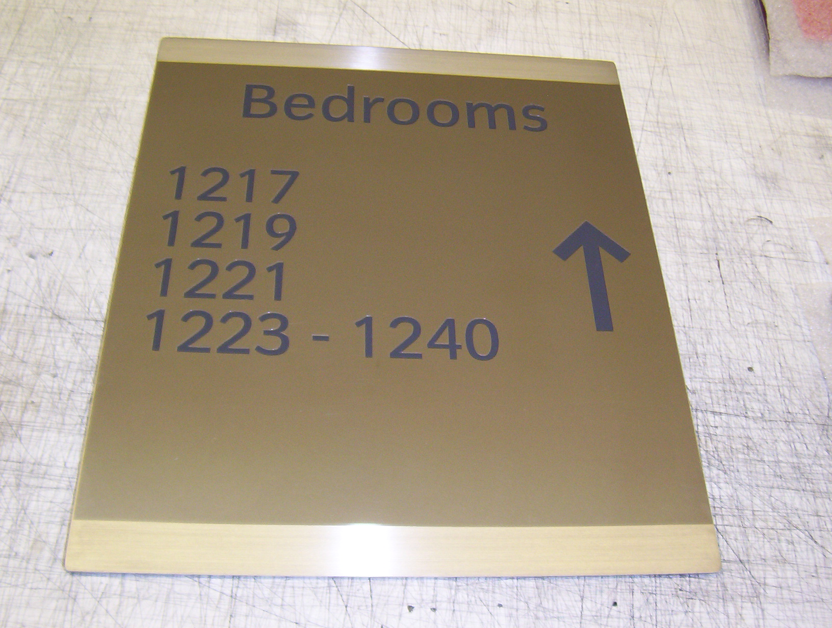 One of 2,000 shaded brass hotel signs